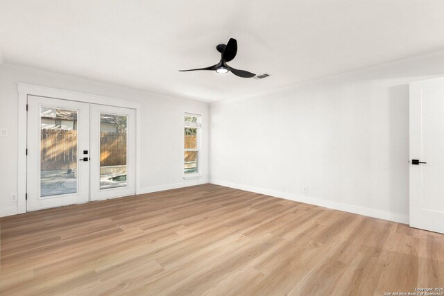 spare room with ornamental molding, ceiling fan, light hardwood / wood-style floors, and french doors