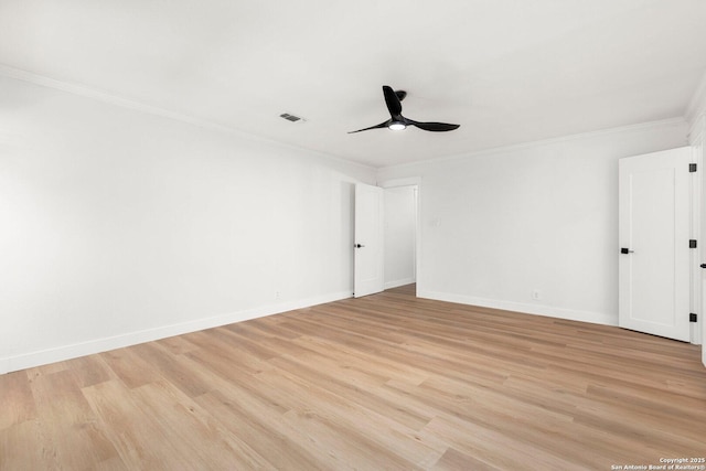 empty room featuring ornamental molding, light wood-type flooring, and ceiling fan