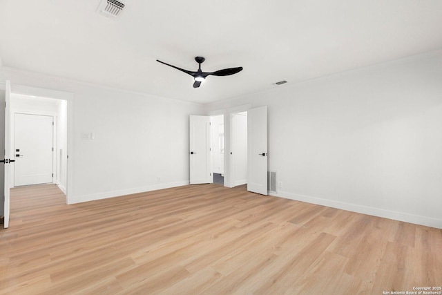 spare room featuring crown molding, ceiling fan, and light wood-type flooring