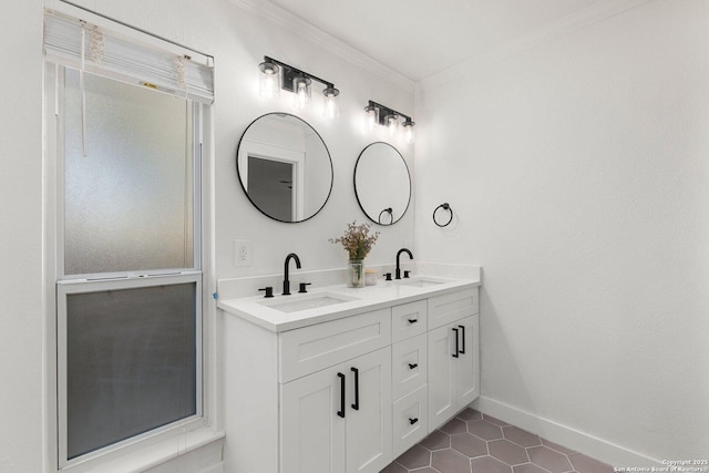 bathroom featuring tile patterned flooring, vanity, and crown molding