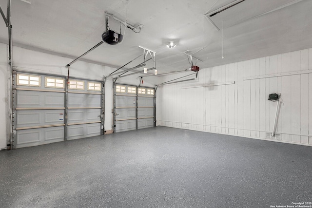 garage featuring a garage door opener