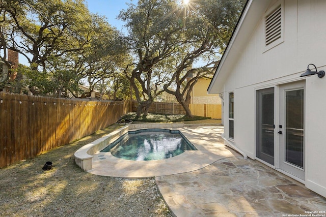 view of pool featuring french doors and a patio area