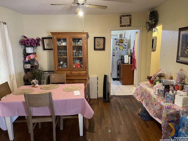 dining space featuring ceiling fan and wood-type flooring