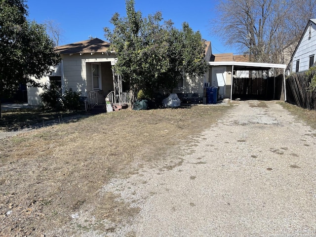 view of front of property featuring a carport