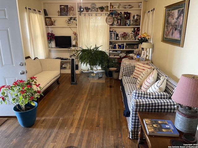 living room with dark hardwood / wood-style flooring