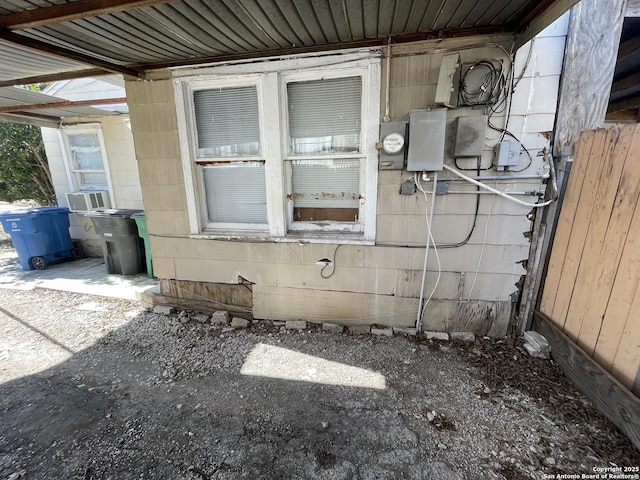 view of side of home featuring cooling unit