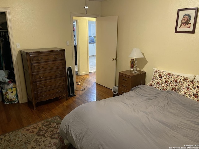 bedroom featuring hardwood / wood-style flooring and a closet