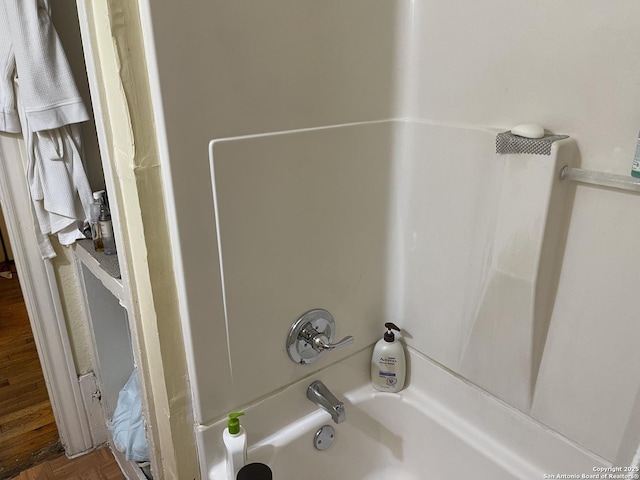 details featuring shower / bath combination