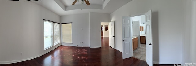 spare room featuring ceiling fan and dark hardwood / wood-style flooring