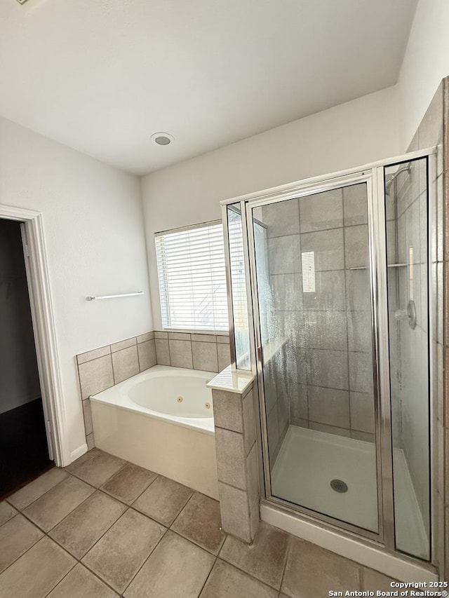 bathroom featuring shower with separate bathtub and tile patterned floors