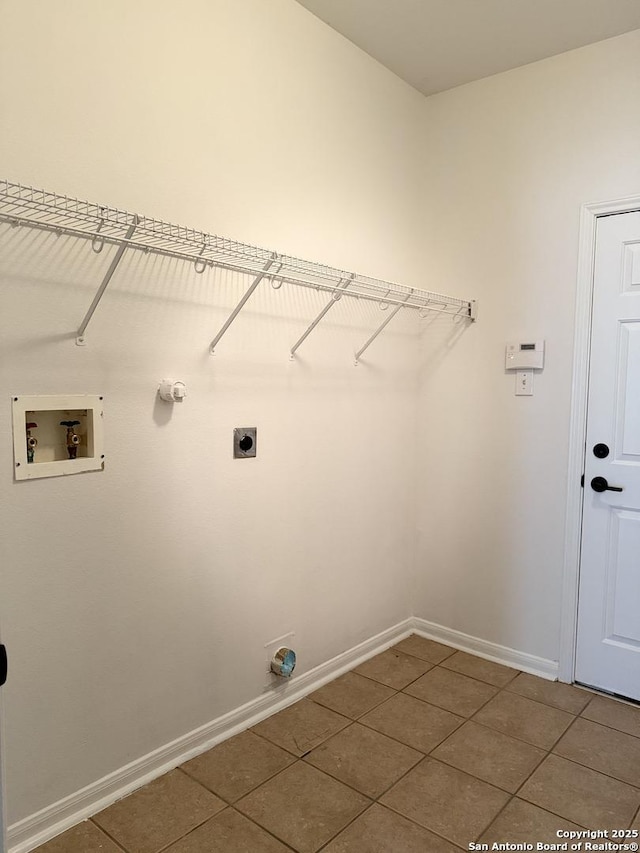 washroom featuring hookup for a washing machine, tile patterned flooring, electric dryer hookup, and hookup for a gas dryer