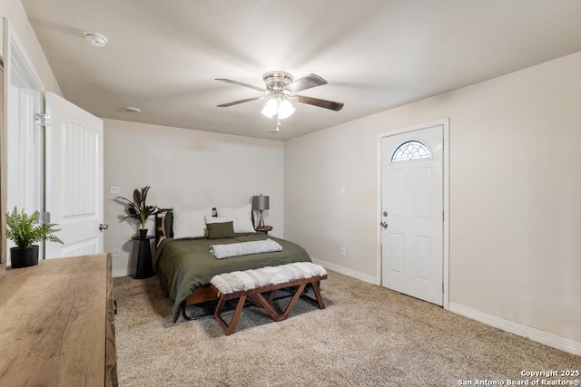 bedroom featuring ceiling fan and light colored carpet