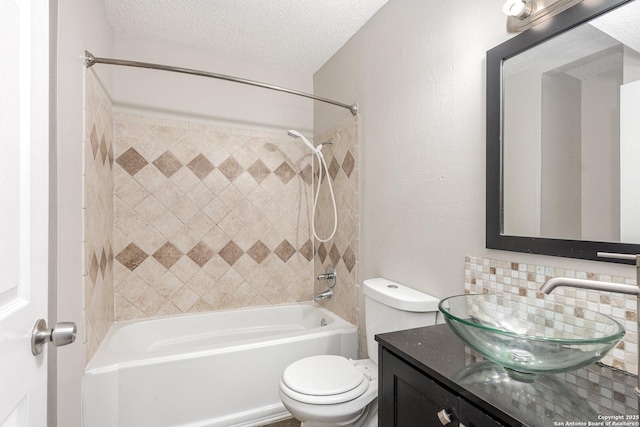 full bathroom featuring a textured ceiling, shower / bathing tub combination, vanity, tasteful backsplash, and toilet