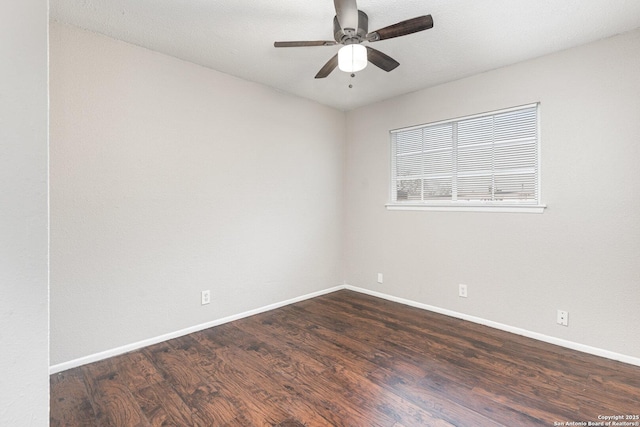 unfurnished room featuring dark hardwood / wood-style floors and ceiling fan