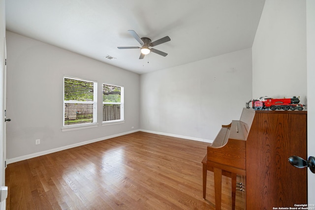 spare room featuring ceiling fan and light wood-type flooring