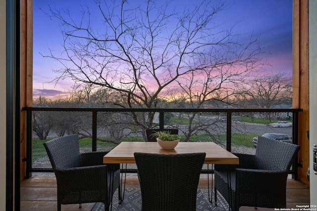 view of balcony at dusk