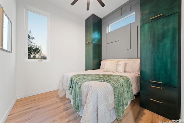 bedroom featuring ceiling fan and light wood-type flooring