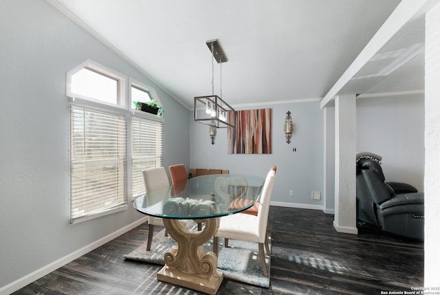 dining area featuring crown molding, lofted ceiling, and dark hardwood / wood-style flooring