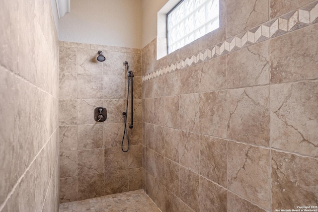 bathroom featuring tiled shower