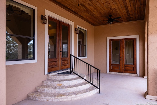 doorway to property featuring ceiling fan and french doors