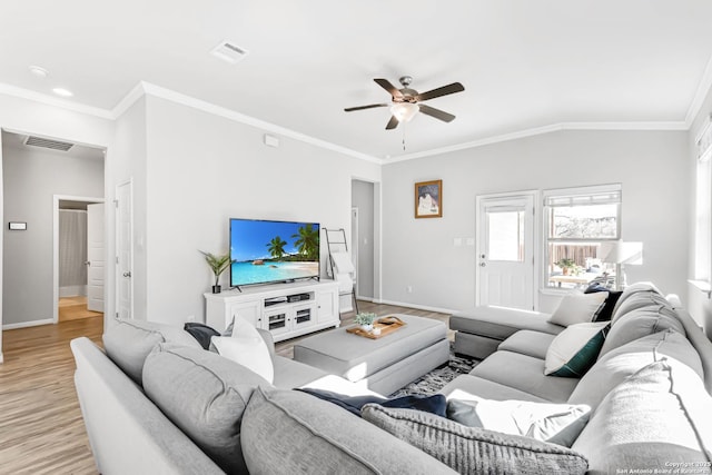 living room with crown molding, light hardwood / wood-style floors, vaulted ceiling, and ceiling fan