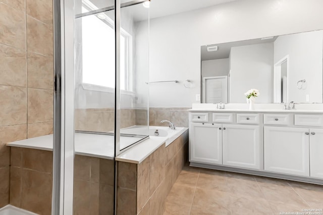 bathroom with vanity, independent shower and bath, and tile patterned floors