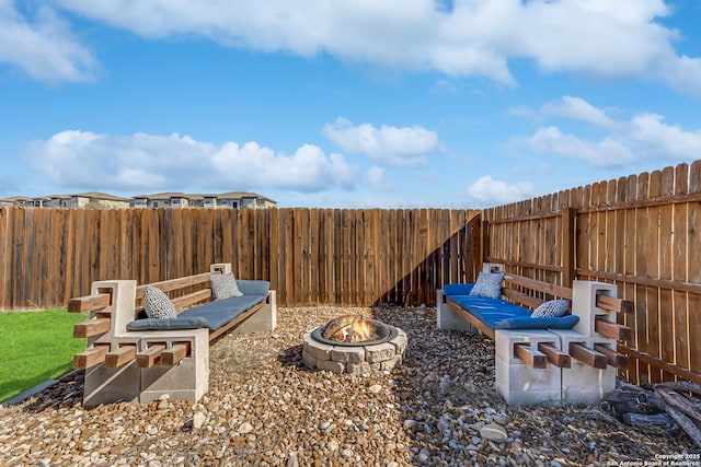 view of yard with a fire pit