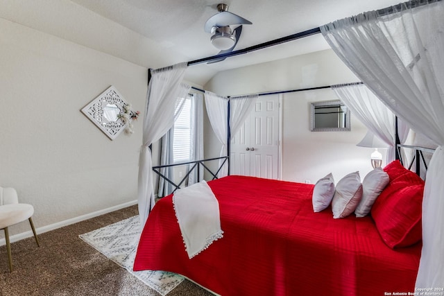 carpeted bedroom with vaulted ceiling