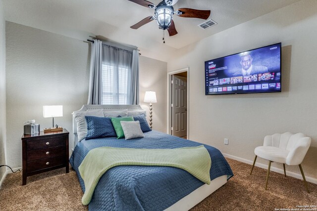 carpeted bedroom with ceiling fan and lofted ceiling