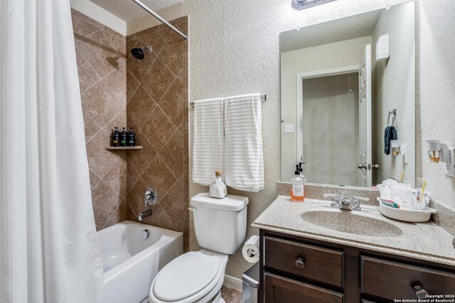 full bathroom with shower / bath combo with shower curtain, toilet, and vanity