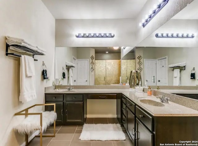 bathroom featuring tile patterned floors and vanity