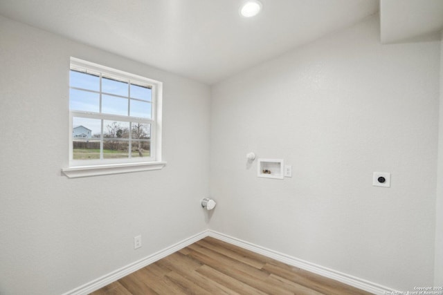 laundry room with hookup for an electric dryer, hardwood / wood-style floors, and hookup for a washing machine