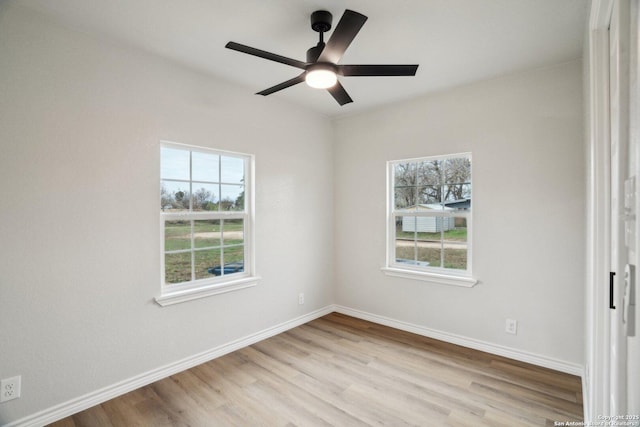 unfurnished room featuring light wood-type flooring and ceiling fan