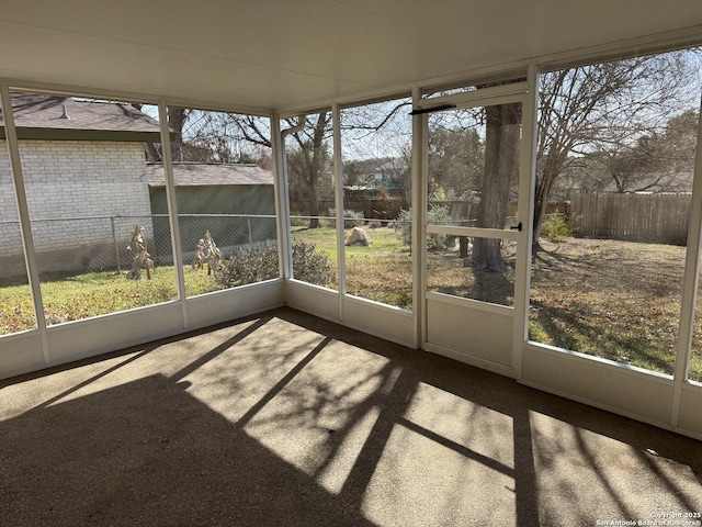 unfurnished sunroom featuring a healthy amount of sunlight