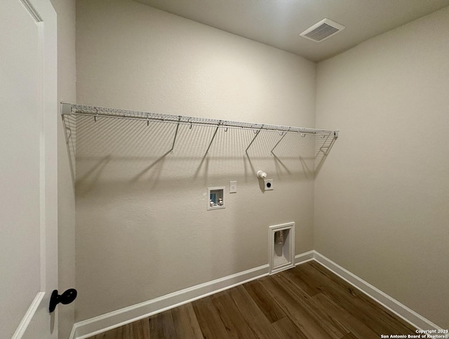 clothes washing area featuring electric dryer hookup, hookup for a washing machine, hookup for a gas dryer, and dark hardwood / wood-style floors