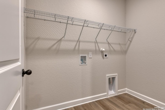 laundry area featuring washer hookup, dark hardwood / wood-style floors, hookup for an electric dryer, and gas dryer hookup