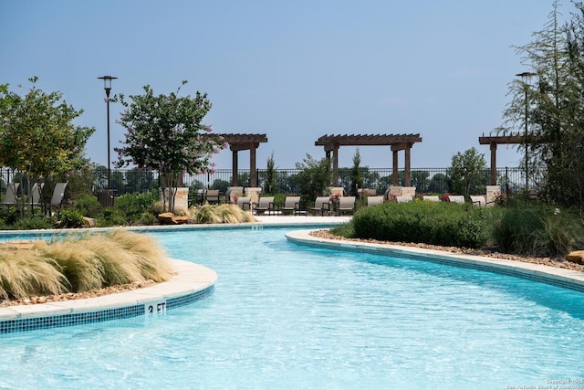 view of swimming pool featuring a pergola