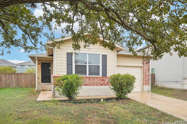 view of front of house featuring a garage and a front yard