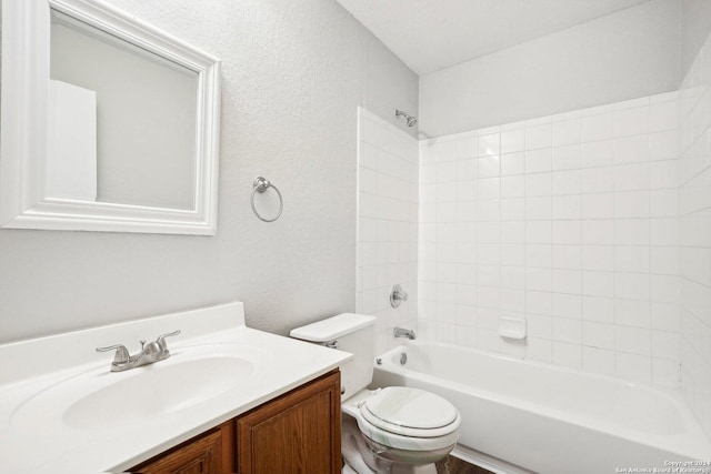 full bathroom featuring bathing tub / shower combination, toilet, and vanity