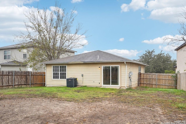 rear view of house featuring cooling unit