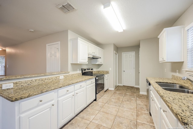 kitchen with kitchen peninsula, sink, white cabinets, light tile patterned floors, and stainless steel appliances