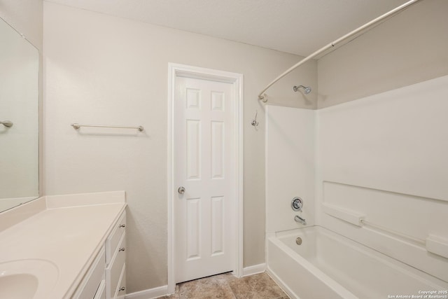 bathroom with vanity and  shower combination