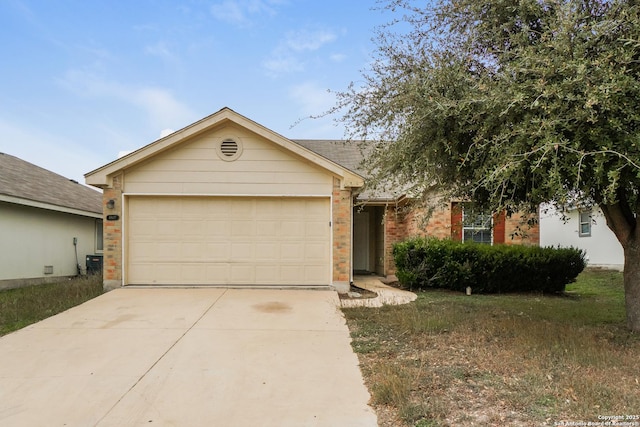 ranch-style home with a garage and central AC unit