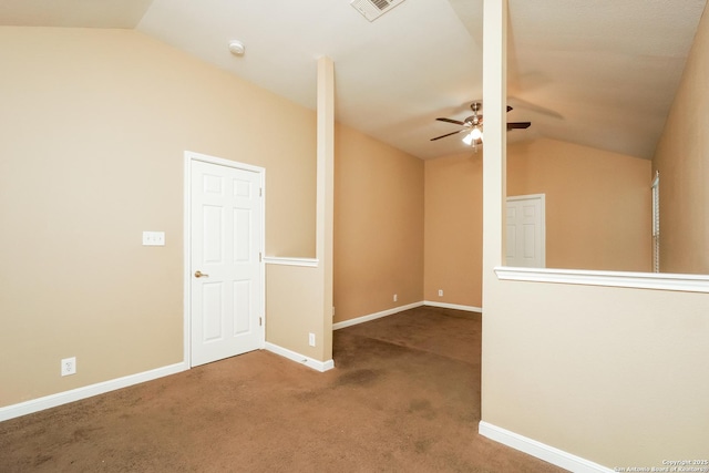 carpeted spare room with ceiling fan and lofted ceiling