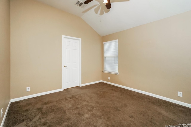 empty room with ceiling fan, dark colored carpet, and lofted ceiling