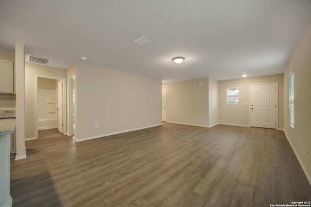 3411 Mccrae Xing, San Antonio, TX 78264 - unfurnished living room with dark hardwood / wood-style floors