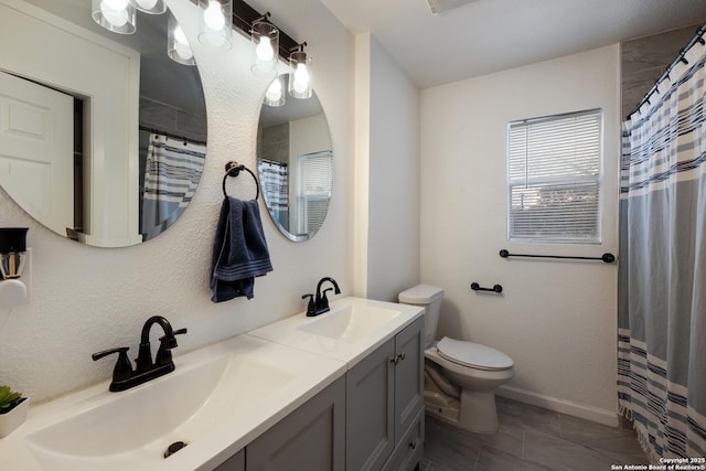 bathroom featuring a shower with curtain, toilet, and vanity