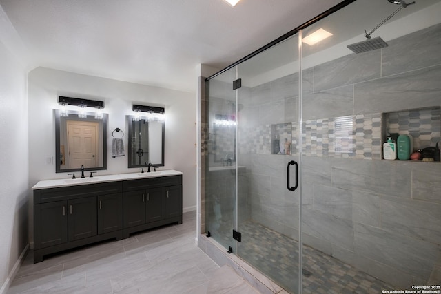 bathroom featuring vanity and an enclosed shower