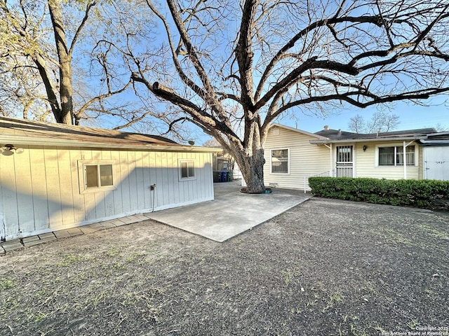 back of property with a patio area