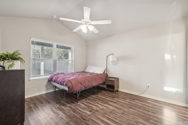 bedroom featuring vaulted ceiling, ceiling fan, and dark hardwood / wood-style flooring